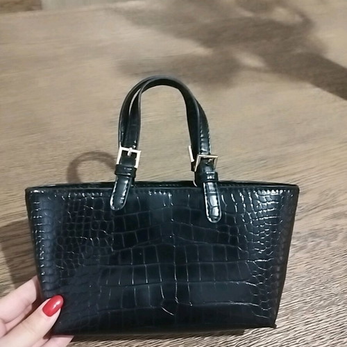 Small black handheld bag with croco texture like new
