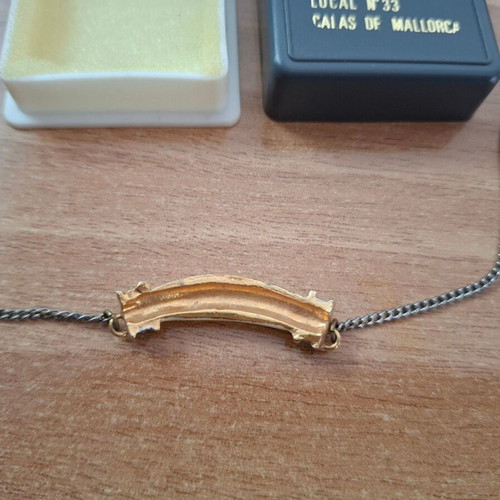 Necklace with ivory tusk pendant used, gold caps and strass decoration