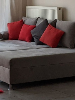 Corner sofa bed gray used with storage space
