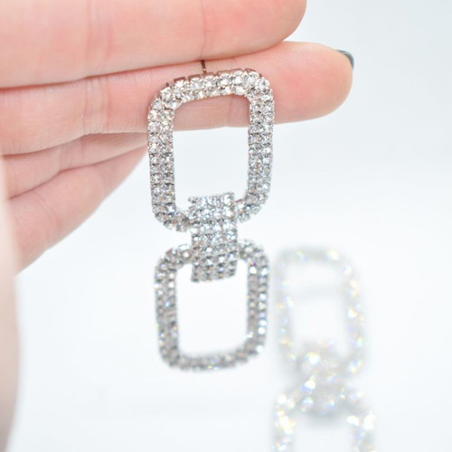 Earrings in silver color with gliter new
