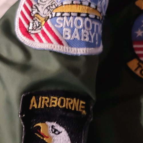 Flight jacket with embroidered patches like new, size 12