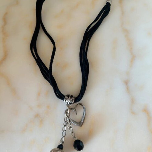 Choker necklace like new with black cord and silver decorative elements