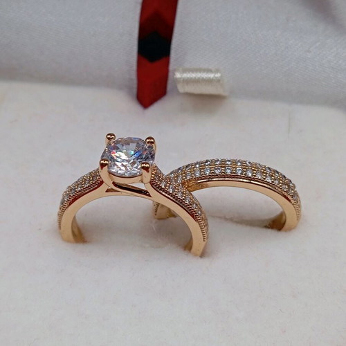 Set of solitaire ring and wedding band plated new with zircon