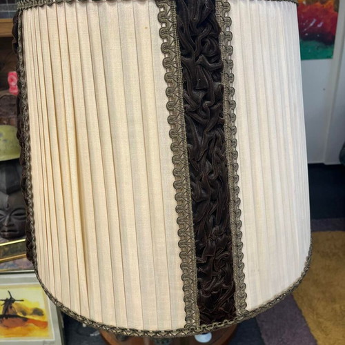 Vintage floor lamp used with ornate metal base and pleated fabric shade