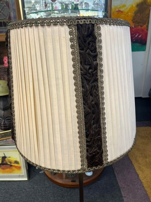 Vintage floor lamp used with ornate metal base and pleated fabric shade