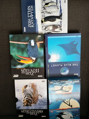 Collectible documentary DVDs used, with cases