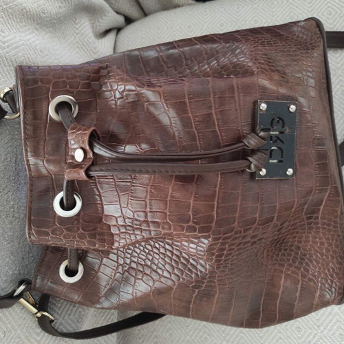 Brown bucket bag with shoulder and crossbody strap