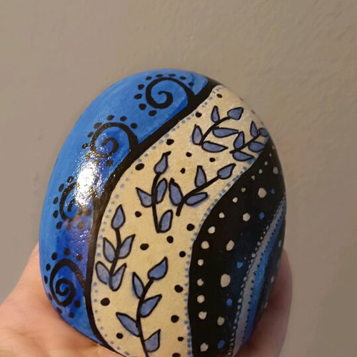 Painted stone new with acrylics and glossy varnish