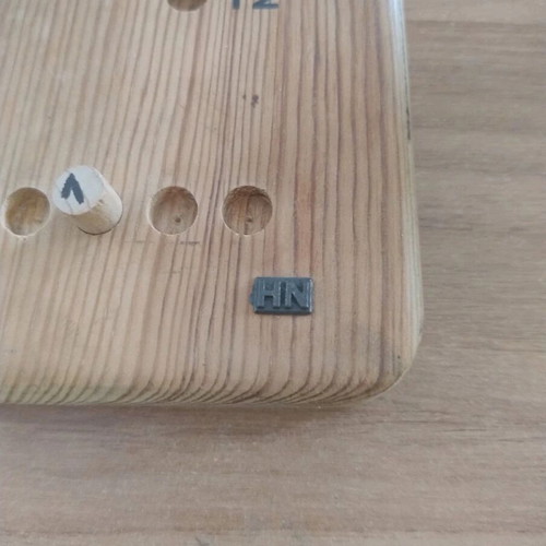 Vintage wooden calendar with pegs