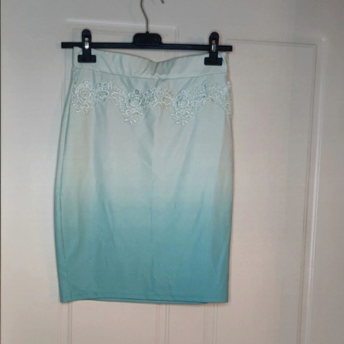Women's clothing set used, turquoise with lace details