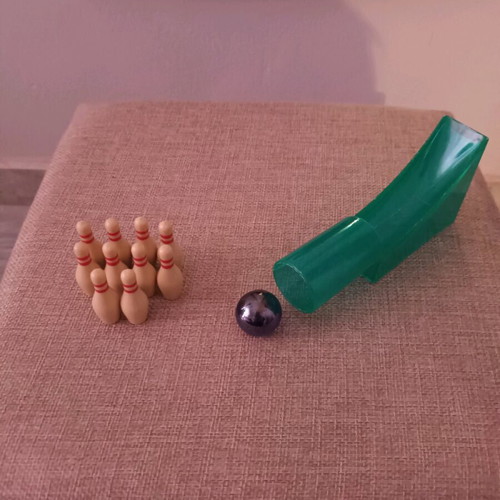 Mini bowling game like new with 10 pins, ball and slide