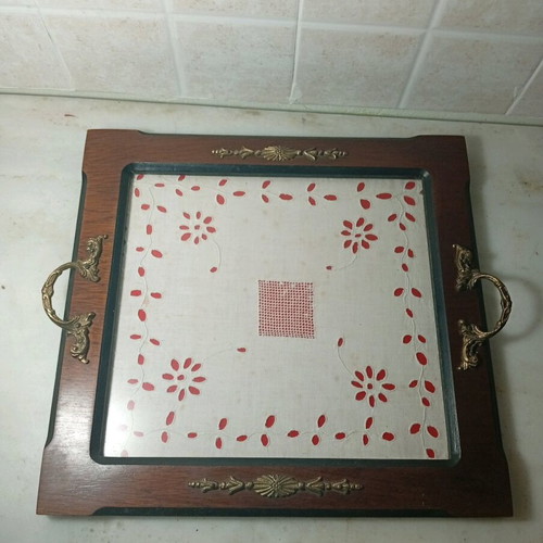 Traditional wooden serving tray used with handmade embroidery