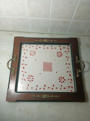 Traditional wooden serving tray used with handmade embroidery