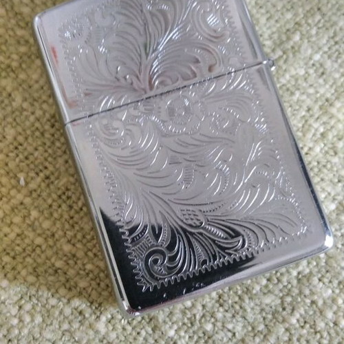 Zippo lighter collectible like new, silver with engravings