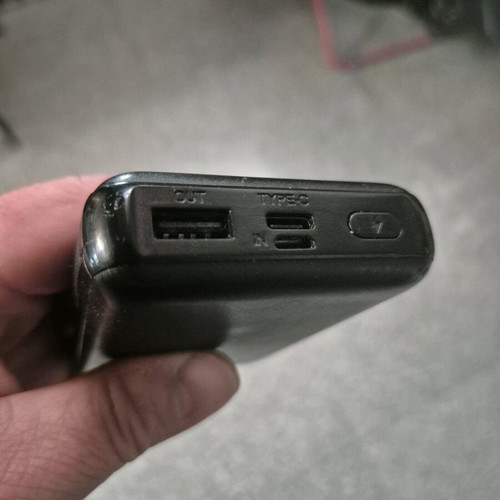USAMS Power Bank 10,000mAh used with digital display and built-in cables