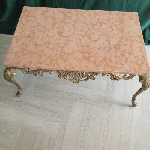 Bronze coffee table used with pink marble