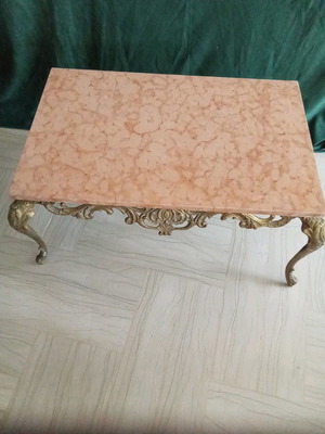 Bronze coffee table used with pink marble