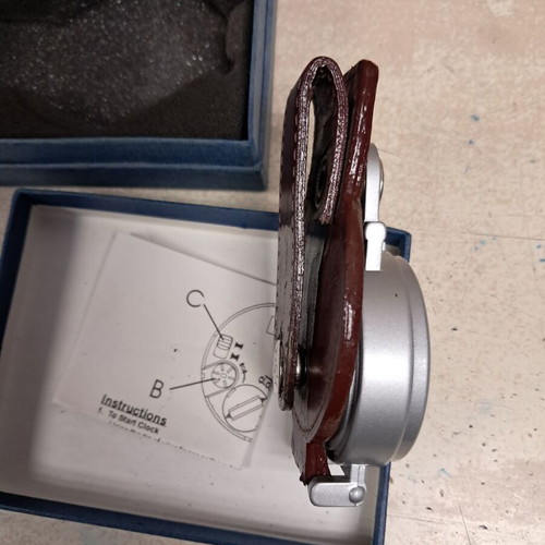 Travel alarm clock like new with leather cover