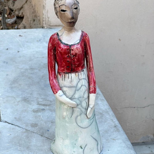 Handmade artistic ceramic woman statue used with rustic style