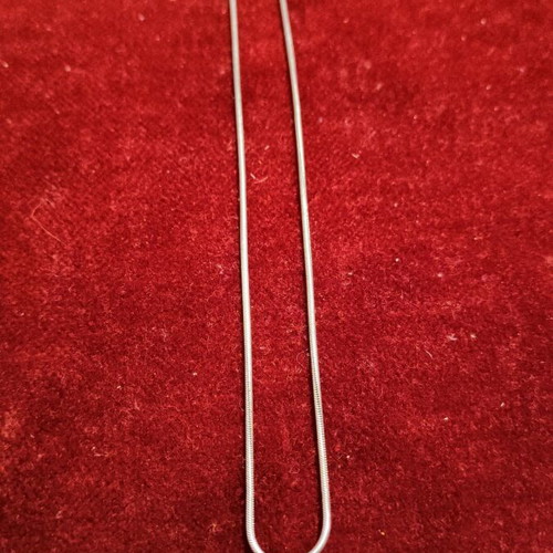 Necklace with 9.25 silver chain and Phaistos disc like new