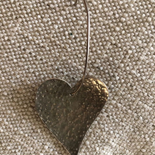 Silver earrings used in heart shape