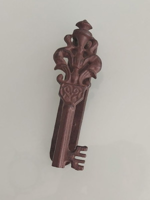 Metal key-shaped door knocker used, vintage style