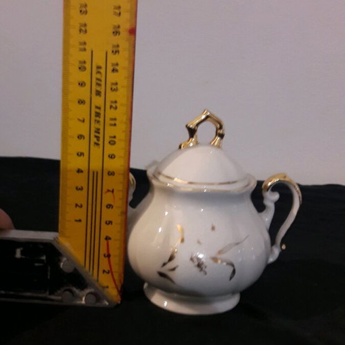 Vintage porcelain teapot and sugar bowl set like new
