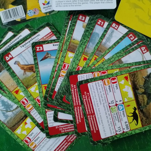 Yperatou card games used, cats and dinosaurs
