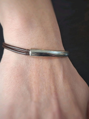 Nautical bracelet used with brown leather strap and metal element