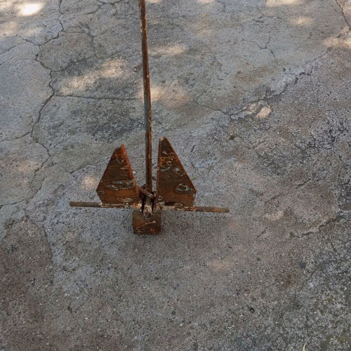 Anchor used for small boat, old and rusty