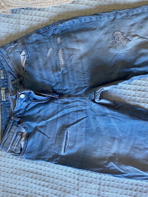 Women's jeans used with rips and patches, blue, sizes XL and XXL