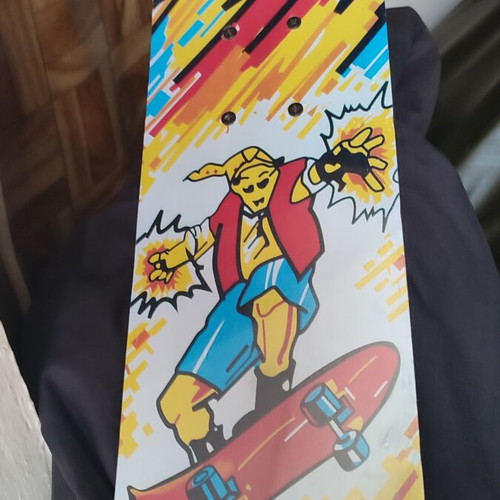 Children's skateboard with colorful comic design, sealed