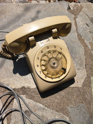 Retro rotary telephone used, yellow, wired