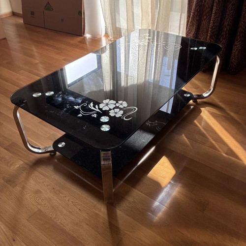 Low glass coffee table, black with floral design
