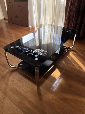 Low glass coffee table, black with floral design