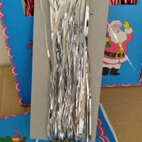 Vintage Christmas tinsel in red, gold and silver