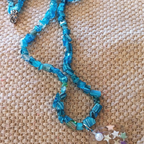 Handmade turquoise necklace with beads and transparent shell