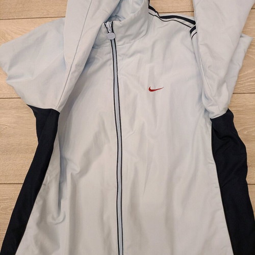 Vintage Nike windbreaker jacket used in ice blue with dark navy details