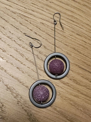 Dangling earrings like new with purple lava stone