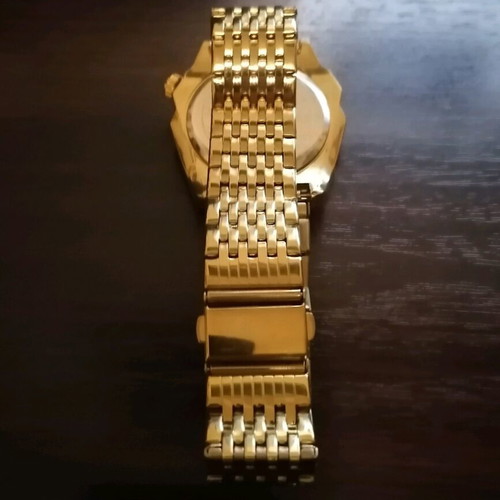 Binbond men's watch like new, gold color bracelet