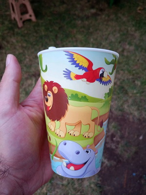 Plastic cup used with built-in straw