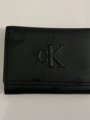 Calvin Klein black wallet like new with stain on back side