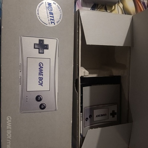 Game Boy Micro like new with 3 games, original packaging and charger