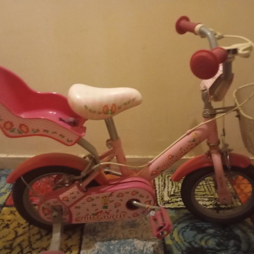 Children's pink bike with training wheels used