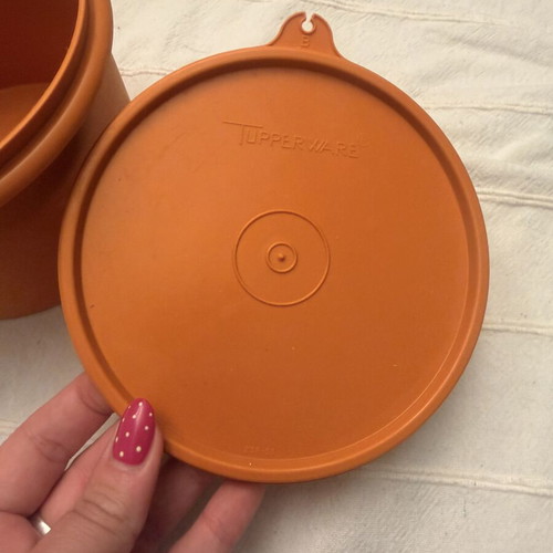 Tupperwear vintage deep circle orange container with lid used