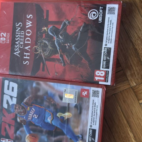 Nintendo Switch 2 games package NBA 2K26 and Assassin's Creed Shadows, sealed