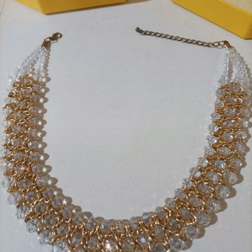 Women's evening necklace like new with gold weave and white stones
