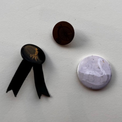 Set of pins and badges like new