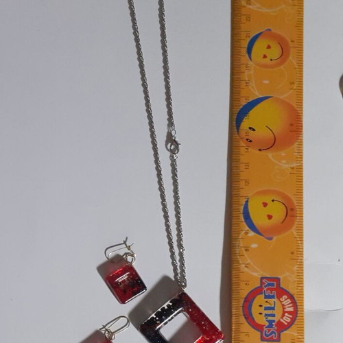 Two sets of handmade pendants and earrings, multicolor