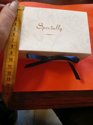Elegant gift box used "specially for you" with blue ribbon